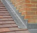 Stepped leadwork/flashing on pitched tile roof